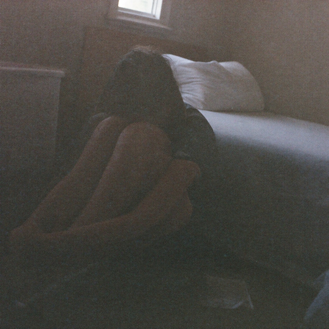 A lonely teenager sitting alone — the way no one asked how you felt growing up